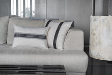 Load image into Gallery viewer, Mood shot of the charcoal block printed stripe design lumbar sitting in front of the double striped charcoal printed cotton cushion cover