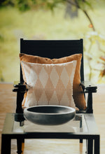 Load image into Gallery viewer, Terracotta coloured block printed cushion cover sitting in front of a cotton hand woven terracotta  sham