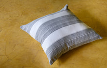 Load image into Gallery viewer, Lifestyle shot of a Block printed charcoal striped cushion cover on a mustard floor