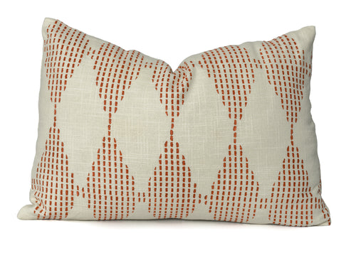 Terracotta block printed cotton cushion cover on an ivory cotton fabric