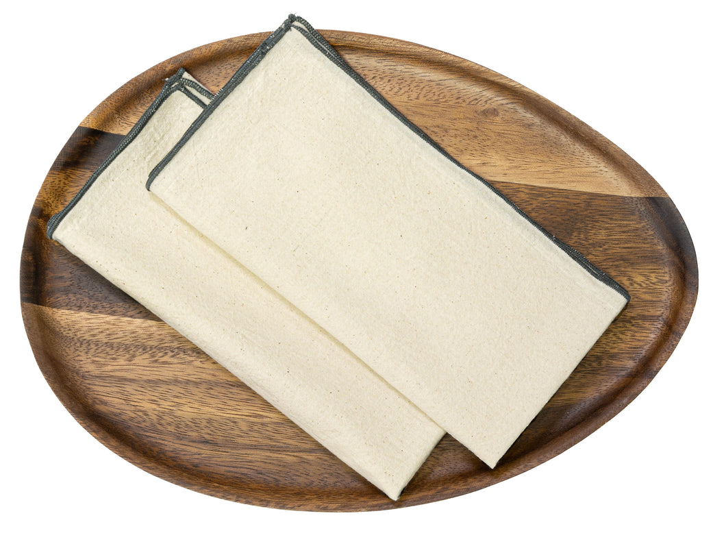 Hand spun cotton table napkin in a charcoal marrow edge design