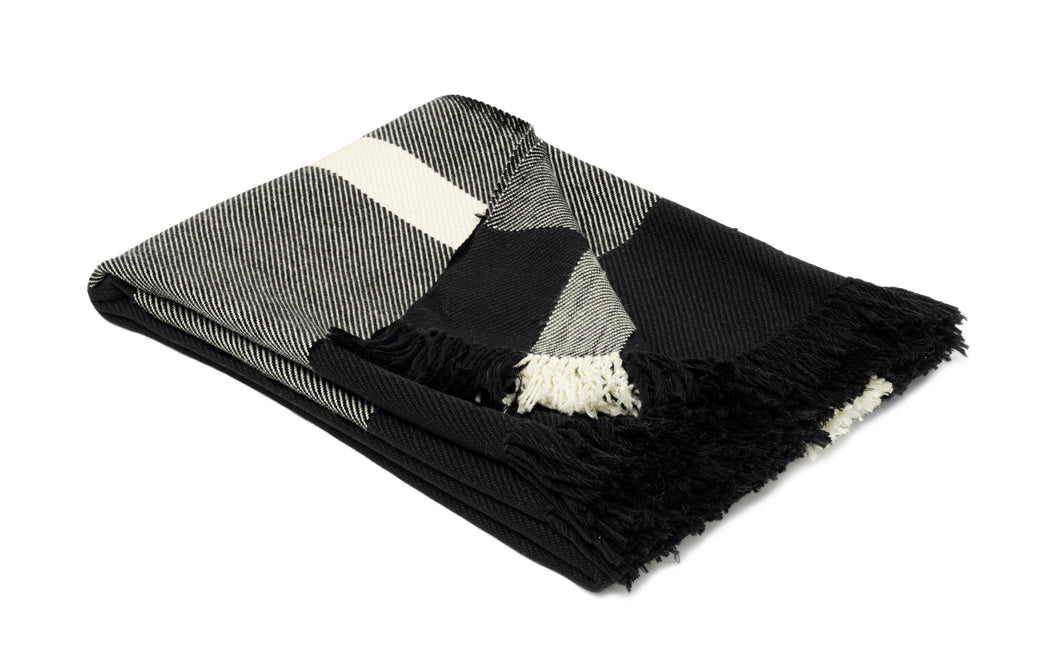 Hand woven woollen throw blanket in a black and ivory colour