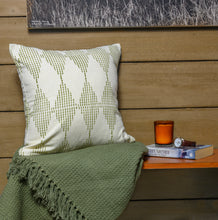 Load image into Gallery viewer, Olive block printed cotton cushion cover is sitting on a hand woven cotton green throw blanket
