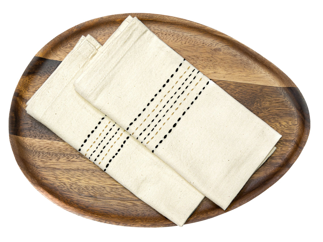 Hand spun, hand stitched cotton table napkins in a charcoal colour.